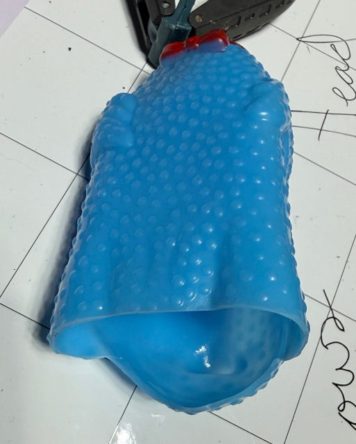 The rubber chicken, feet removed.