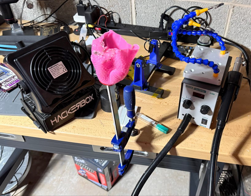 This is my workstation setup, with a clamp attached to the workbench and the chicken on the bar of the clamp.