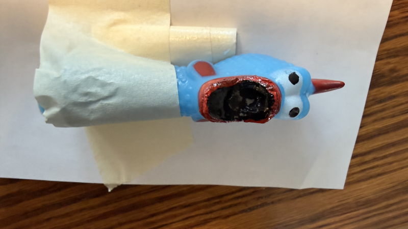 The "just a head" chicken, mouth sealed up so the squeaker will work.